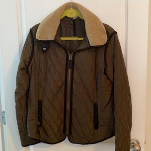 Olive green, light puffer jacket.